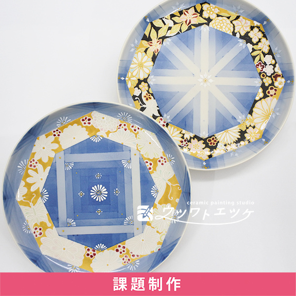 染付と和の上絵具で文様と花柄が描かれた丸皿2枚